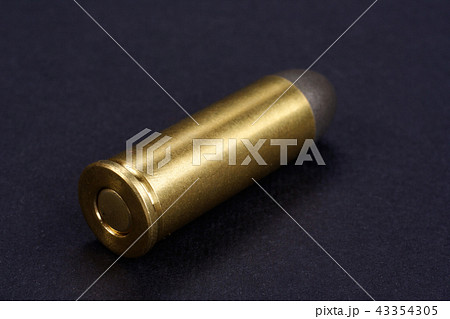 Wild West Revolver cartridges on black background Wild West Revolver cartridges on black background 43354305