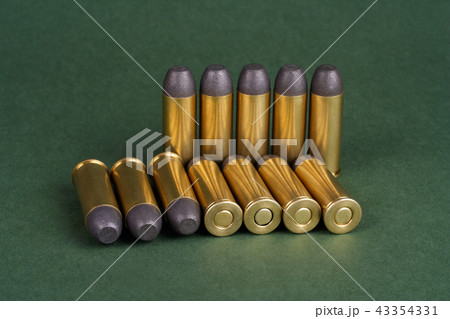 Wild West Revolver cartridges on green background 43354331