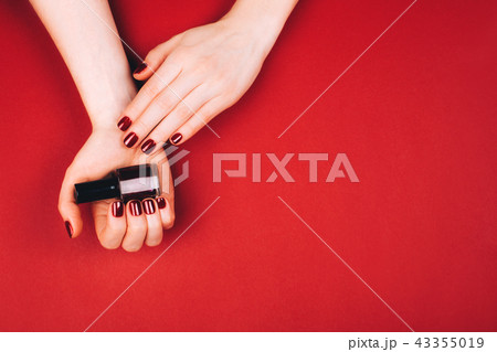Woman making self manicure Woman making self manicure 43355019