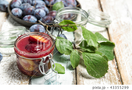 Plums jam wooden background Marmalade preparing 43355299