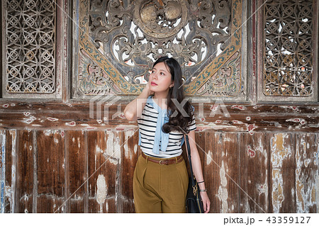 asian woman standing in Longshan Temple. asian woman standing in Longshan Temple. 43359127