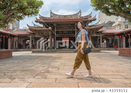 asian tourist walking in the temple. 43359151