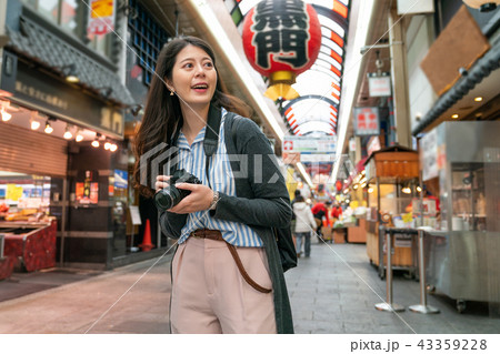 asian female visiting japanese market. 43359228