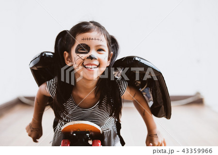 asian child girl play with roller board with fun asian child girl play with roller board with fun 43359966