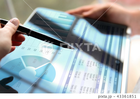 Business colleagues working and analyzing. Laptop 43361851