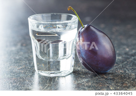Plum brandy and plums. 43364045