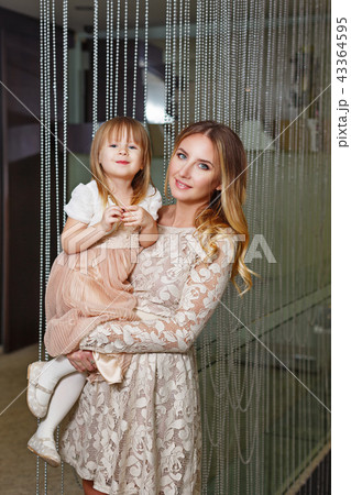 Mother and daughter hugging Mother and daughter hugging 43364595