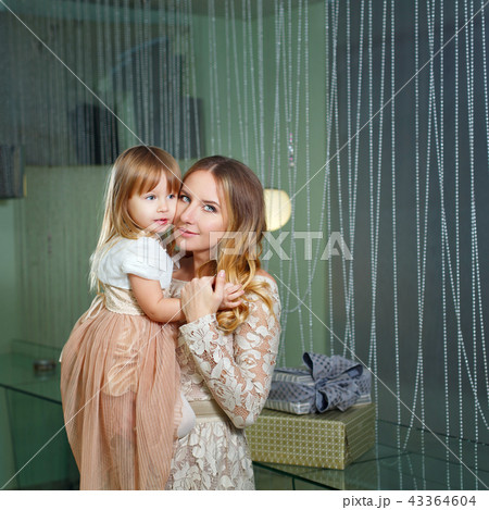 Mother and daughter hugging 43364604