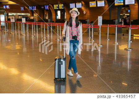 asian visitor ready for boarding. 43365457