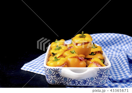 Yellow pepper stuffed with meat and rice in a pan for baking, on a black background and .Free space 43365671