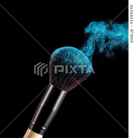 Make up brush with powder splashes on black background Make up brush with powder splashes on black background 43369240