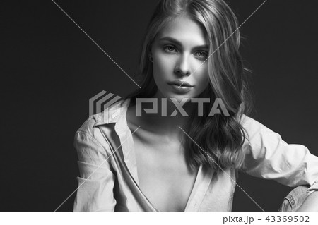 fashion model with long hair, perfect skin is posing in studio for glamour test photo shoot showing fashion model with long hair, perfect skin is posing in studio for glamour test photo shoot showing 43369502