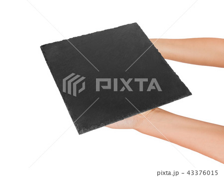 woman hand holding empty square slate platter woman hand holding empty square slate platter 43376015