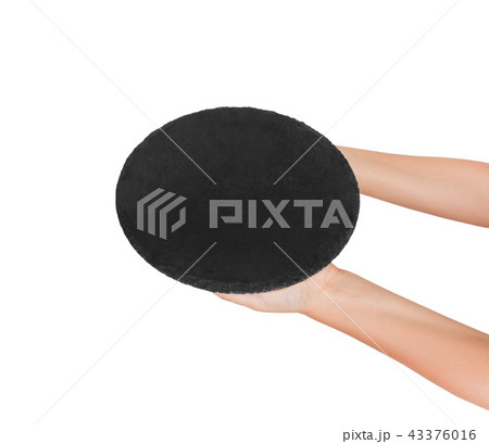 empty black slate round stone in the hand empty black slate round stone in the hand 43376016