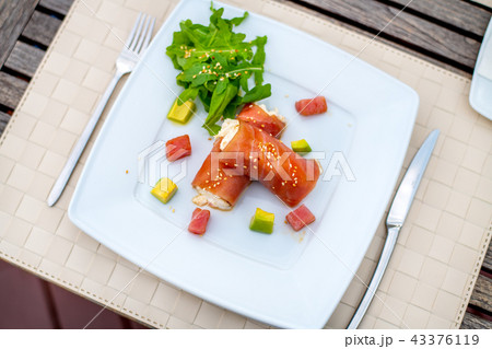rolls of tuna with crab meat on the plate 43376119