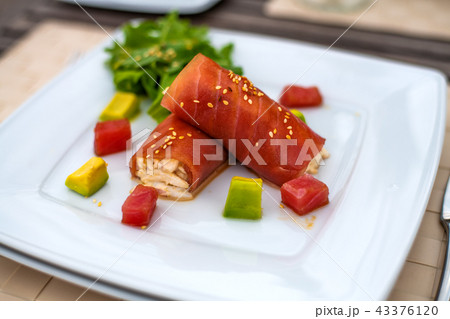 rolls of tuna with crab meat on the plate 43376120