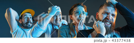 The emotional angry men screaming on blue studio background 43377438