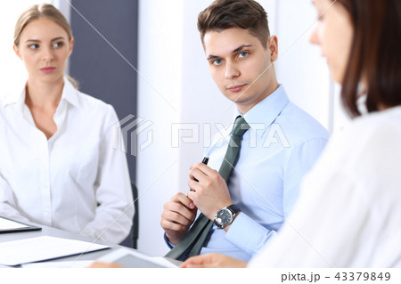 Group of business people or lawyers discussing terms of transaction in office. Meeting and teamwor Group of business people or lawyers discussing terms of transaction in office. Meeting and teamwor 43379849