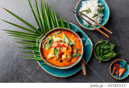 THAI SHRIMPS RED CURRY. Thailand Thai tradition red curry soup with shrimps prawns and coconut milk THAI SHRIMPS RED CURRY. Thailand Thai tradition red curry soup with shrimps prawns and coconut milk 43383553