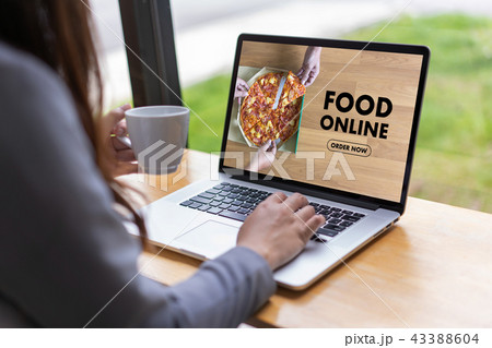 Close up woman ordering food online  by internet  43388604