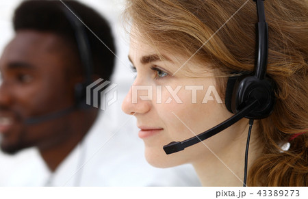 Call center operator.Young beautiful  brunette woman in headset. Business concept 43389273