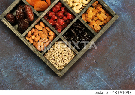 dried fruits and nuts in a wooden box dried fruits and nuts in a wooden box 43391098
