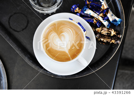 foam on cappuccino in the form of a heart 43391266