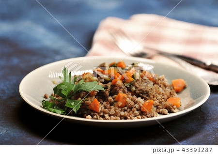 buckwheat porridge with stewed meat and carrots buckwheat porridge with stewed meat and carrots 43391287