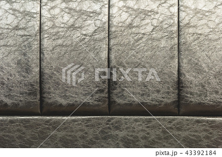 The texture of the real leather on the back of the bed. Vertical stripes of bulk skin are black 43392184