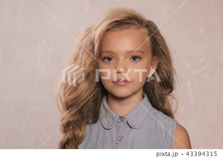 cute little 8-9 year old girl with blonde hair 43394315