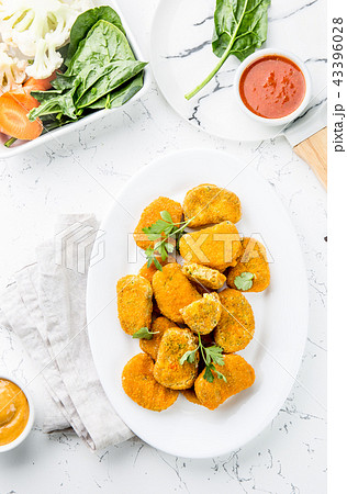 Healthy vegetarian nuggets with carrots, cauliflower and spinach. Vegetable nuggets. Vegan food. Top 43396028