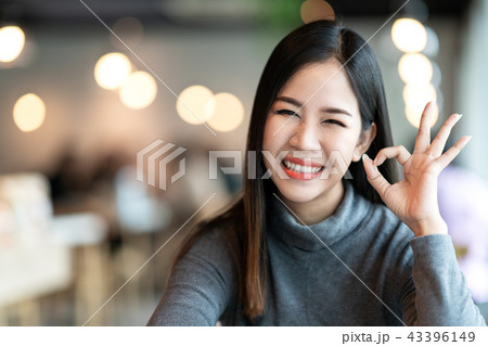 Portrait of young attractive asian woman looking a 43396149