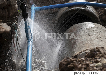 Water pipe break .Exposing a burst water main 43396998
