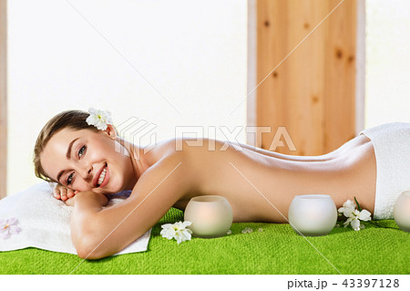 Young woman lying on massage table and waiting. Young woman lying on massage table and waiting. 43397128