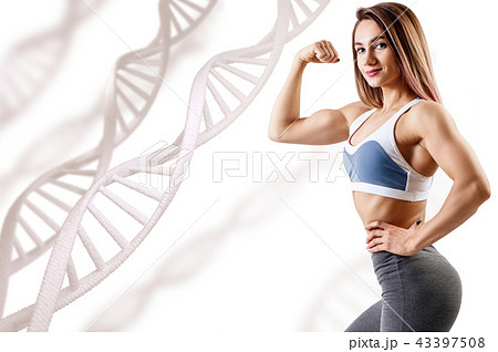 Athletic fitness woman standing among DNA chains. 43397508