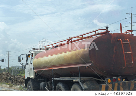 Truck of oil and old red on the road Truck of oil and old red on the road 43397928
