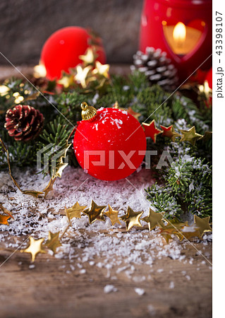 Red Christmas bauble with snow and candle 43398107