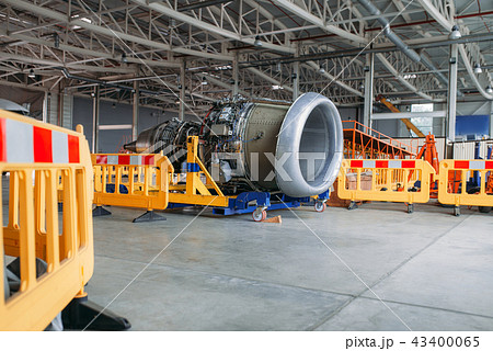 Plane engine without covers, maintenance in hangar Plane engine without covers, maintenance in hangar 43400065