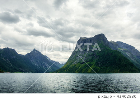 Dramatic evening view of Hjorundfjorden fjord Dramatic evening view of Hjorundfjorden fjord 43402830
