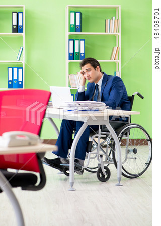 Disabled businessman working in the office Disabled businessman working in the office 43403701