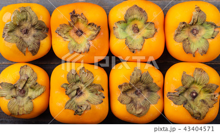 Ripe persimmon fruit background 43404571