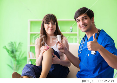 Female patient visiting male doctor in medical concept Female patient visiting male doctor in medical concept 43405234