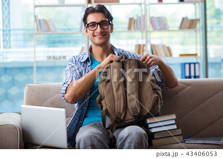 Caucasian student with laptop preparing for university exams Caucasian student with laptop preparing for university exams 43406053