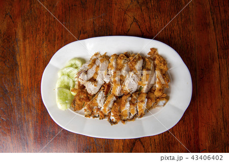 The fried chicken in a dish with cucumber The fried chicken in a dish with cucumber 43406402