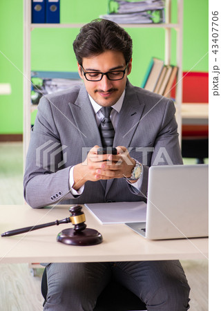 Young handsome lawyer working in the office  43407706