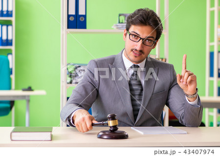 Young handsome lawyer working in the office  43407974