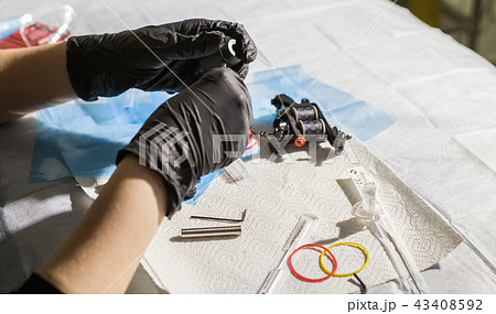 master tattoo artist prepares tools for tattooing. 43408592