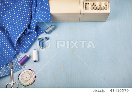 Sewing machine and blue fabric Sewing machine and blue fabric 43410570