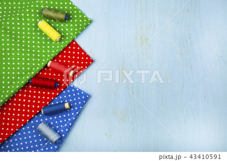 Coils with threads and multi-colored fabrics Coils with threads and multi-colored fabrics 43410591