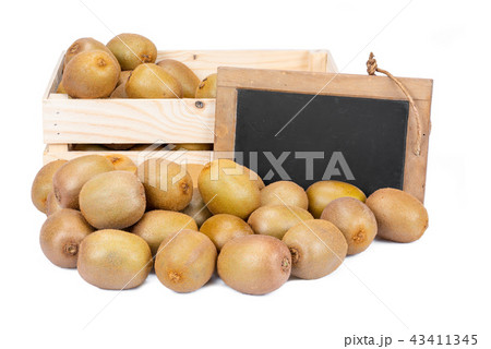 Wooden box with ripe kiwis and a slate blackboard Wooden box with ripe kiwis and a slate blackboard 43411345